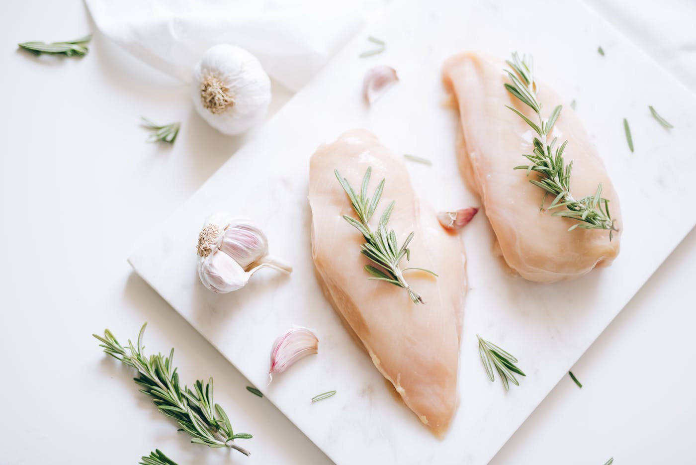 Fresh raw country-breed chicken breasts, ready to dispatch
